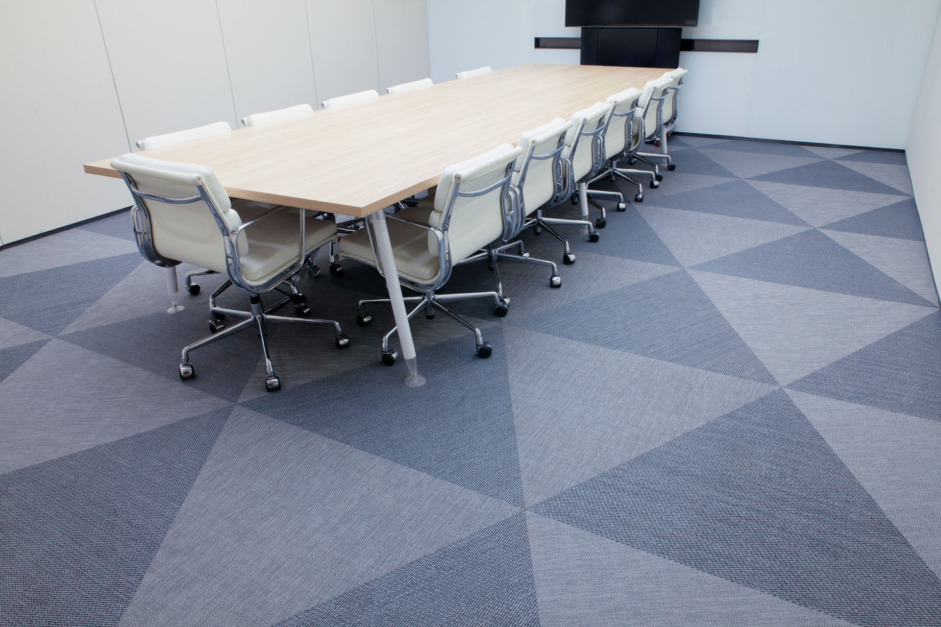 Conference table with teleconference screen